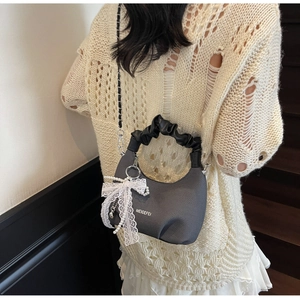 Gray textured crescent handbag with black pleated handle and lace pearl charm detail