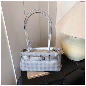 Detail of silver-grey shoulder bag with classic plaid pattern and silver buckle decoration
