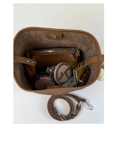Interior view of brown lychee texture bucket bag showing inner pouch and storage space