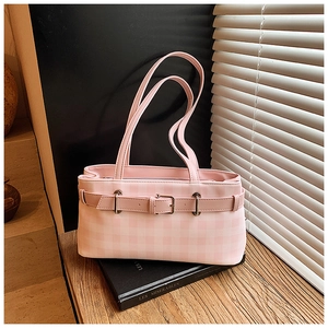 Detail of pink plaid shoulder bag with leather belt buckle and silver metal hardware