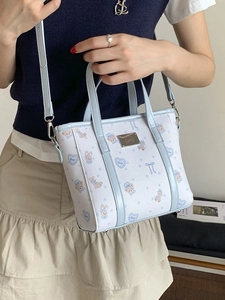 Light blue bucket bag with cartoon bear print and adjustable strap for women