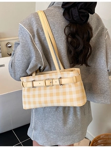 Chic yellow checkered shoulder bag with metallic buckle and slim straps for women