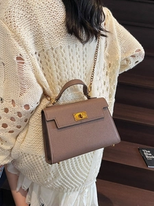 Chic taupe trapezoid handbag with lychee texture and golden metal chain strap