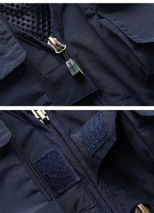Detail of metal zipper with SPORTS puller and breathable mesh lining on tactical vest