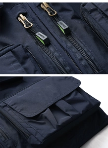 Detail view of durable navy fishing vest showing sports zippers and utility flap pockets