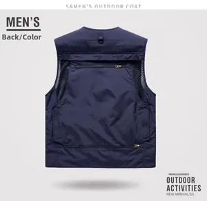 Macro detail of breathable mesh back panels and zipper pockets on outdoor blue vest