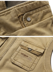 Close-up of khaki outdoor fishing vest with corduroy collar and durable canvas texture
