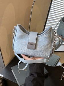 Light blue denim shoulder bag with sparkling rhinestones and silver chain strap details