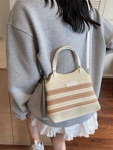 Striped knit bucket bag with round handles and adjustable strap for casual summer style