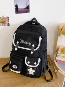 Sac à dos d'école en toile noire avec bordure blanche et pendentif étoile