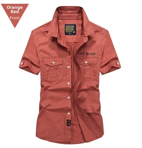 Detail of orange short sleeve military style shirt with double breast pockets and embroidery