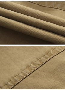 Detail view of khaki cotton vest featuring durable double-row stitching and twill texture