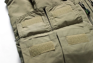 Detailed close-up of durable tactical vest with multi-pocket velcro and zipper design