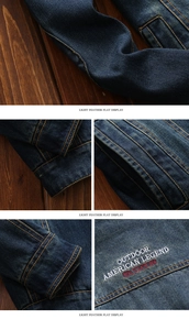 Detail of heavy denim fabric with yellow contrast stitching and outdoor embroidery