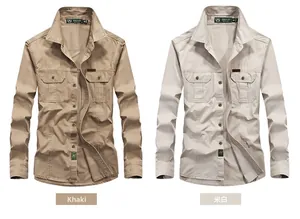 Detail of long sleeve work shirts in khaki and off-white with dual chest flap pockets