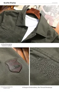Detail view of military green cotton jacket with leather patches and chest embroidery