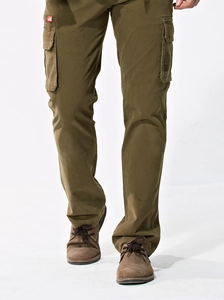 Close-up of olive green cargo pants with flap pockets and high-quality cotton twill texture