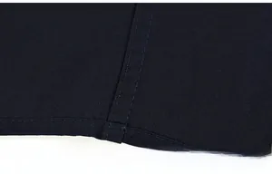 Macro shot of precise double-row stitching on deep blue fabric for business shirts