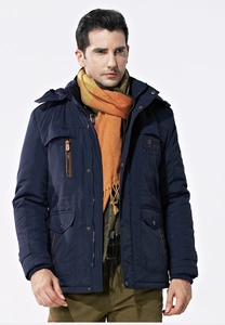 Detail of dark blue winter hooded jacket with multiple pockets and zipper closure
