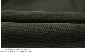 Close-up of olive green twill cotton fabric showing detailed texture and thick material