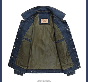 Detailed close-up of dark blue denim jacket with olive green mesh lining and metal buttons
