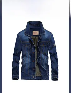 Close-up of classic blue denim jacket detailing with flap pockets and metal buttons