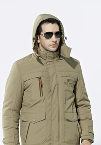 Detail of khaki winter parka featuring chest embroidery and adjustable drawstring hood