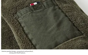 Detailed close-up of internal jacket pocket with fleece lining and tricolor stripe accent
