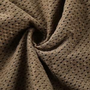 Close-up of khaki breathable mesh fabric for men's outdoor quick-dry jacket