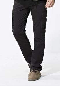 Detailed view of black cargo pants featuring large side pockets and slim-fit utility design