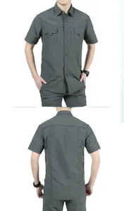 Detail of dark grey short sleeve outdoor shirt with dual chest pockets and print