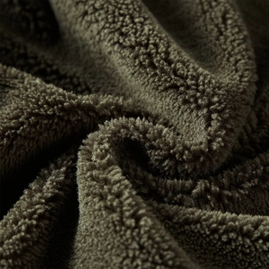 Deep olive green thickened lamb wool fabric with soft granular fleece texture