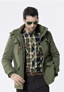 Close-up of military green winter jacket featuring large utility pockets and stand collar