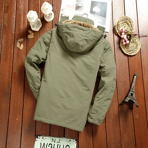 Olive green hooded parka for men with warm fleece lining shown on a wooden background