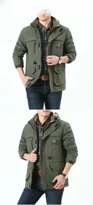 Detail view of military green hooded outdoor jacket with functional utility pockets