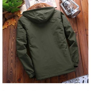 Detail view of winter padded jacket with warm fleece lining and hood on vintage wood