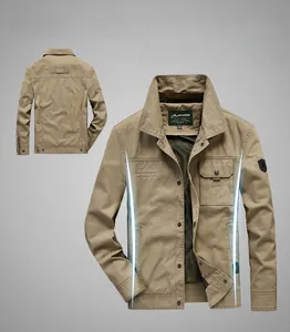 Detail view of khaki outdoor men's jacket with flap chest pocket and badge insignia