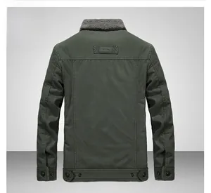 Detail view of military green winter jacket featuring fashion patch and faux fur collar