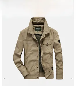 Detail view of khaki outdoor utility jacket featuring shoulder straps and flap pockets