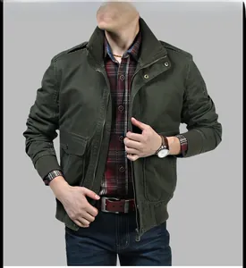 Detail of army green military jacket with ribbed cuffs and metal zipper closure