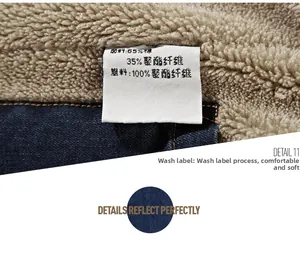Detailed view of denim jacket care label showing 65% cotton and fleece lining