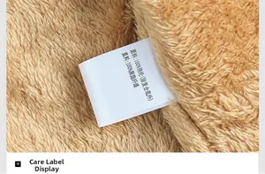 Close-up of windproof jacket lining showing brown fleece texture and washing label