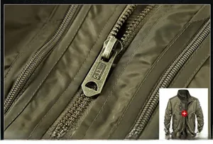 Dettaglio della giacca tattica verde militare con cerniera in ottone incisa 5.11