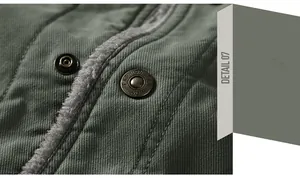Detail of green military jacket featuring warm grey fleece lining and metal buttons