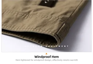Detail of windproof jacket hem with durable twill fabric and outdoor equipment text