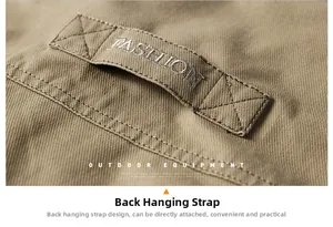 Close-up of khaki outdoor canvas jacket with reinforced strap and Fashion embroidery