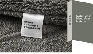 Macro shot of 100% cotton fabric and polyester fleece lining with wash care label details