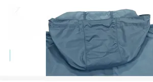 Detail of the packable hood on a blue sun protection jacket with outdoor tech fabric