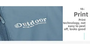 Detail of durable white Outdoor print and high-quality zipper on blue sun protection jacket