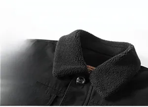 Close-up of black men's winter jacket featuring a thick fleece collar and metal buttons
